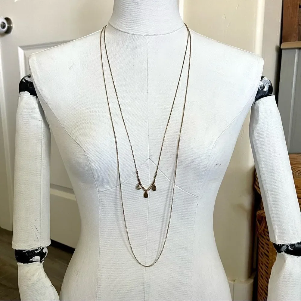 Gold colored two chain necklace